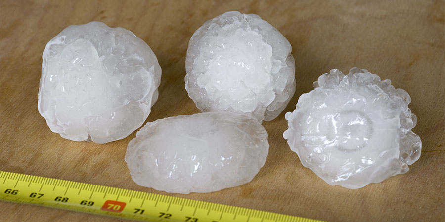 hailstones next to a ruler 